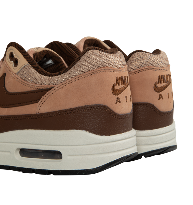 Image 3 of 5 - BROWN - NIKE AIR MAX 1 SC Cacao Wow and Dusted Clay in a rich "Cacao Wow" burgundy-tone mudguard with "Dusted Clay" leather overlays and hemp-hued mesh in the upper.  Featuring leather and mesh upper, air cushioning and rubber outsole, visible Max Air unit in the heel and Nike Air cushioning in the forefoot. The plush foam midsole and padded, low-cut collar add comfort. 