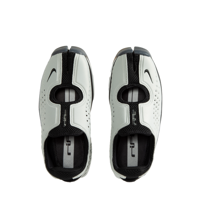 Image 5 of 5 - WHITE - Nike Women's Rift II Sneakers are a one-to-one reissue of the sought-after 2002 update to the iconic Air Rift and feature a streamlined slip-on silhouette, a flexible upper with breathable mesh underlays, and the signature split-toe design. This lightweight sneaker revives a cult-favorite look while maintaining the performance-inspired details that made the original a standout. Main Material: Textile and Synthetic Upper with Mesh Underlays.  