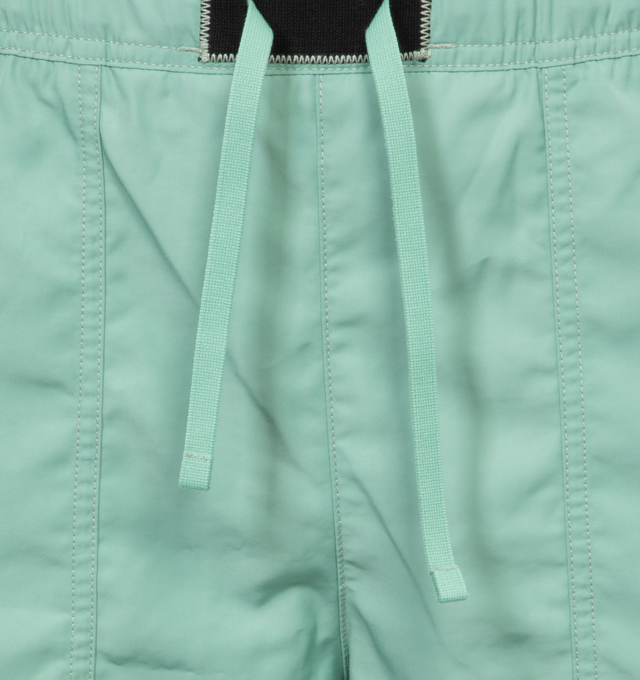 Image 4 of 4 - GREEN - STONE ISLAND Swim Trunks featuring regular fit, patch hand pockets with slanting opening edged with inner tape, back patch pocket with fixed flap and hidden zipper closure with nylon trim, Stone Island Compass patch logo on the left leg, inner mesh lining and elasticized waistband with outer drawstring set on tap tab. 100% polyester. Lining: 100% polyamide/nylon. 