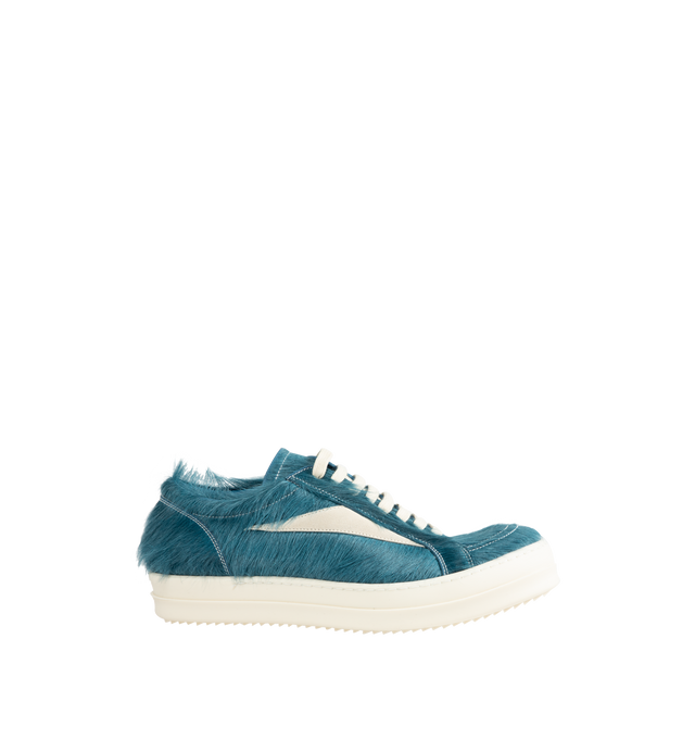 Image 1 of 5 - BLUE - Rick Owens Men's Vintage Sneaks are crafted from hairy suede and full-grain calf leather and feature an under-ankle silhouette with contrast stitching, a padded ankle, and the brand's signature shark-toothed bumper sole. Designed with eight-eyelet lace-up fastening, a toe cap, and a resized triangular leather appliqu at the side for a distinctive vintage-inspired look. Main Material: 100% Calf Leather. Lateral Details: 100% Cow Leather. Lining: 100% Calf Leather. Insole: 100% Calf Leat 