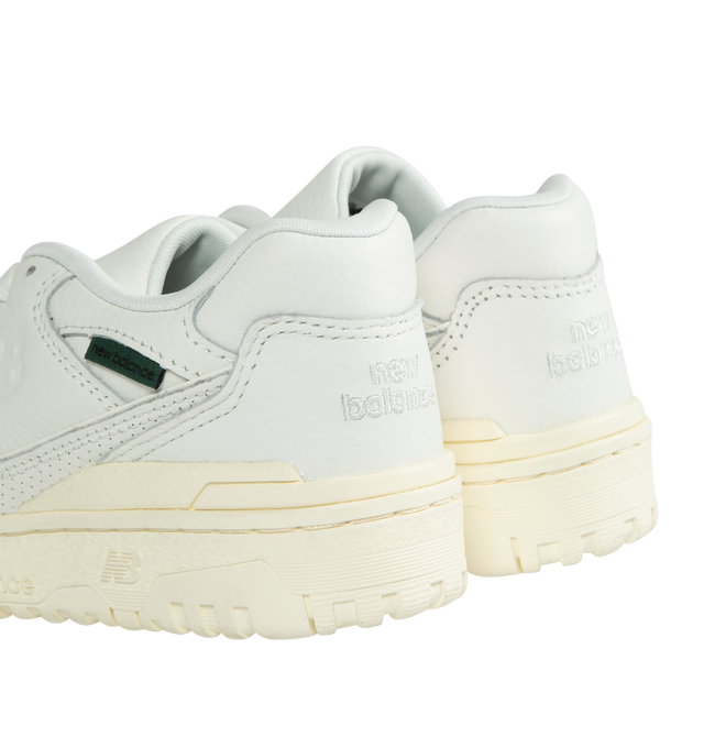Image 3 of 5 - WHITE - NEW BALANCE 550 Mini Logo Sneaker featuring a debossed NB logo, premium white leather, green tag on the lateral ankle and rubber sole.  