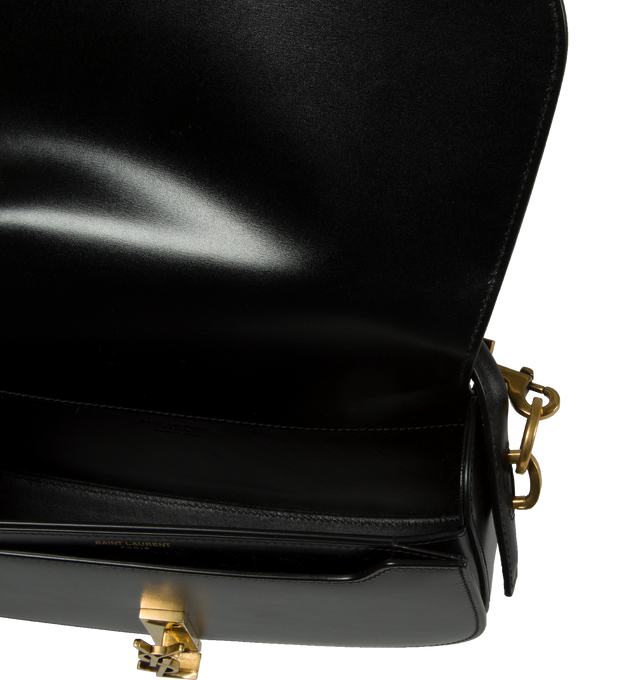 Image 3 of 3 - BLACK - Saint Laurent half-moon shoulder bag in calfskin with a gently polished finish. Features a flap with pivoting Cassandre closure, one flat pocket inside and an adjustable and detachable swivel-hook strap for bespoke carry options.  Calfskin with leather lining, bronze-tone hardware. Measures 9.4" X 5.9" X 2" with a 2.4" handle drop and 10.6" strap drop. Made in Italy. 