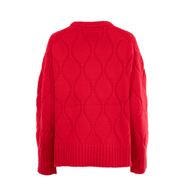 Image 2 of 3 - RED - Guest in Residence women's wavy cozy crewneck sweater made from 100% cashmere in a heavy weight knit. Women's sizing, intended for a boxy, oversized fit. Featuring diamond aran stitch, crew neck, dropped shoulder, reverse jersey detail around arm & shoulder with tuck stitch, ribbed neck trim, cuff, and hem, side slit at hem, jersey cable with signature GIR branding at center back. Premium cashmere sourced from inner Mongolia, manufactured in China. 