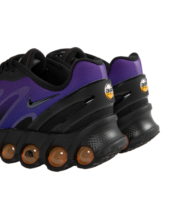 Image 3 of 5 - PURPLE - NIKE Air Max Dn8 Sneaker featuring dynamic Air system with dual-chambered tubes and tuned pressure levels, rubber outsole, plush foam underfoot, sculpted upper made of lightweight mesh on top, while slashes at the sides reveal open mesh for more breathability, plastic heel clip and extra layer across toe tip adds durability. 
