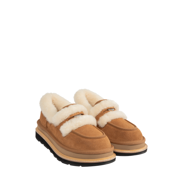 Image 2 of 4 - BROWN - UGG x sacai loafer designed for everyday wear, combines UGG's iconic premium  suede with sacai's unmistakable hybridized aesthetic. Upper is made with suede sourced from certified farms that practice regenerative agriculture upper. Midsole incorporates sugarcane EVA. Features Vibram XS Trek Evo. Unisex style in women's sizes. 