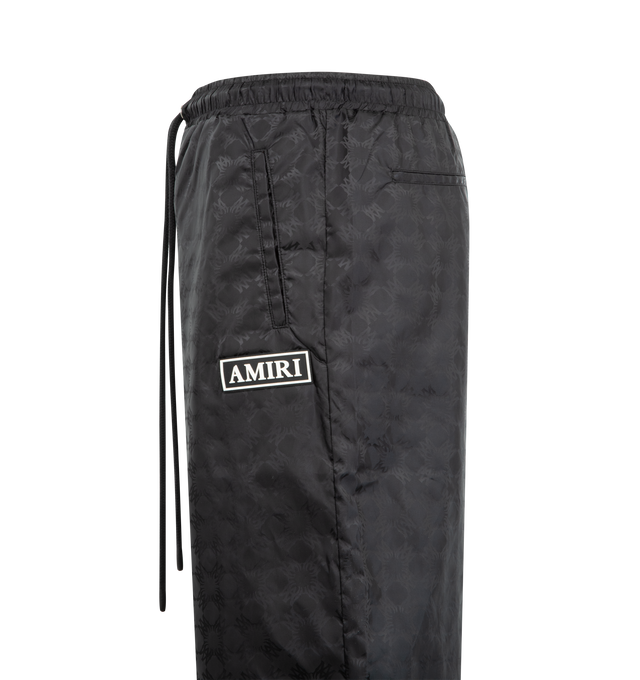 Image 3 of 3 - BLACK - AMIRI MA Quad Nylon Pants featuring elastic waist with drawstring, printed throughout, 4 pocket style, relaxed fit and logo on leg. Nylon. 