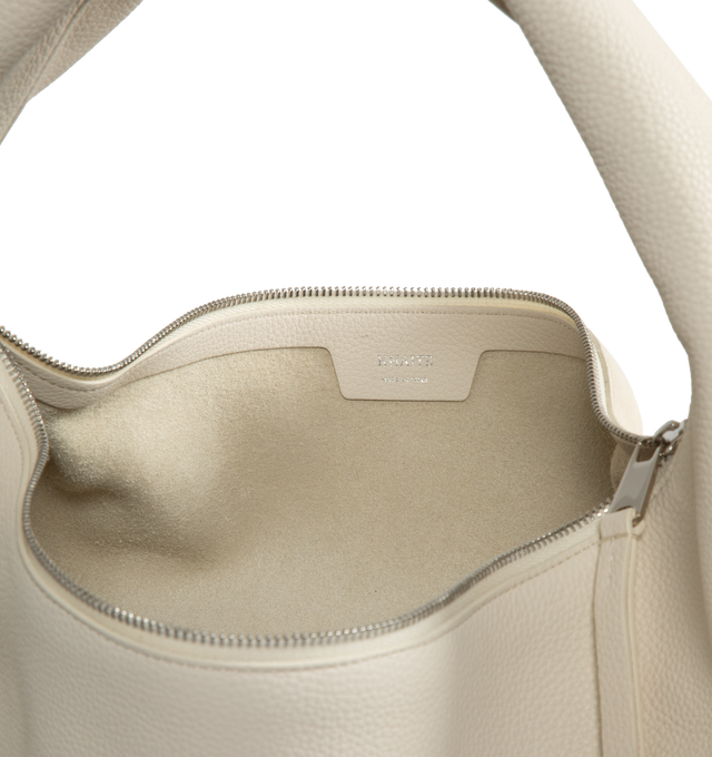 Image 3 of 3 - WHITE - Khaite slouchy zip-top hobo bag in richly textured leather. Slip pocket at interior. With integrated strap to wear over the shoulder or carry by hand. Measures: length: 16 in x width 7 in x height 9.4 in x handle drop: 9 in. 