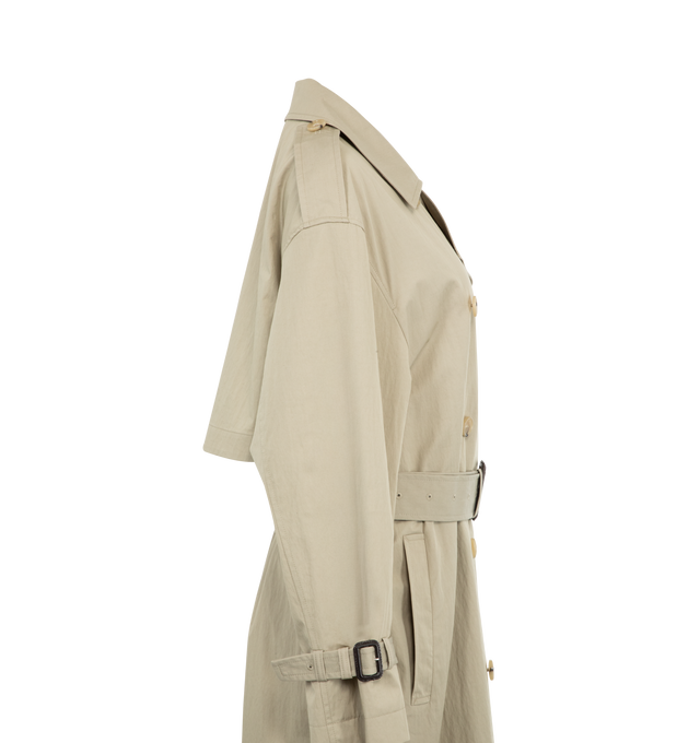 Image 3 of 3 - NEUTRAL - TOTEME Crisp Summer Trench featuring double-breasted button front, welt pockets, epaulettes, waist and cuff belts, inverted box pleat, t-stitch and light, water-resistant fabric. 65% cotton organic, 35% polyamide. Made in Portugal. 