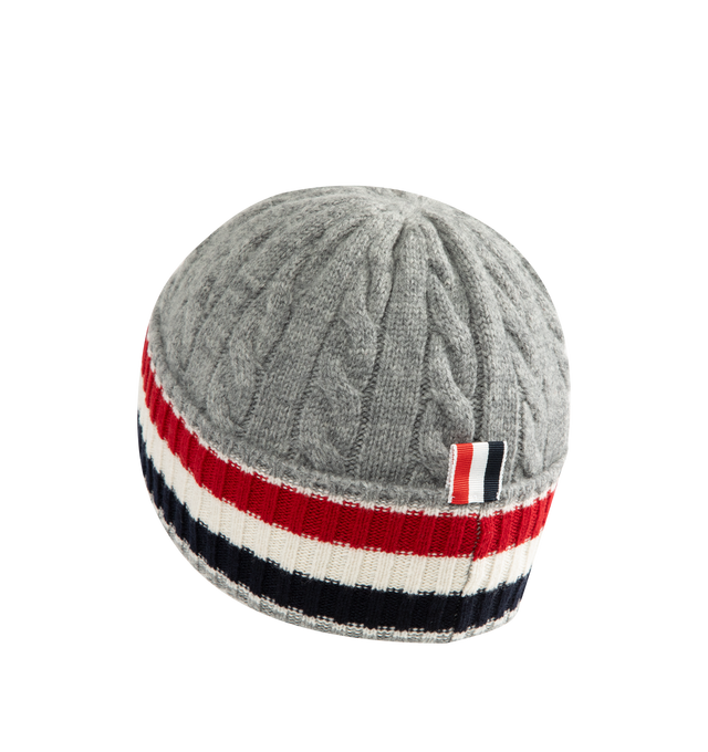 Image 2 of 2 - GREY - Thom Browne Men's Cable & Rib Merino Wool Beanie is crafted from merino wool in a cable-knit construction and features signature RWB stripes at the rib-knit cuff and the brand's signature tricolor grosgrain loop tab at the back. This designer knit beanie combines timeless craftsmanship with iconic Thom Browne detailing for elevated cold-weather wear. Main Material: Merino Wool. Made in Italy. 