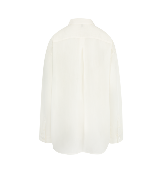 Image 2 of 2 - WHITE - Toteme Classic shirt reworked in fluid, semi-sheer crepe to complement sharp office looks. It has a longline, oversized silhouette with dropped shoulders and a buttoned placket and cuffs. 83% viscose, 17% wool. Made in Portugal. 