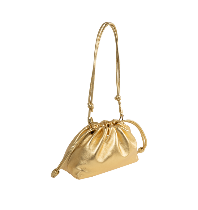 Image 2 of 3 - GOLD - Loewe Medium Flamenco purse in laminated lambskin, defined by a ruched design with key details such as the signature knots at the sides and the donut chain. This medium version is crafted in laminated lambskin. Shoulder, crossbody or hand carry with detachable and adjustable leather strap and detachable donut chain adorned with an Anagram Pebble. Features magnetic closure, suede lining and embossed LOEWE. Height 7.9 X Width 11.8 X Depth 4.1 inches. Made in Spain. 