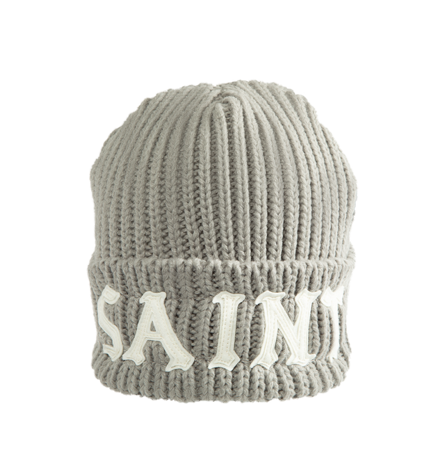 Image 1 of 2 - GREY - SAINT Mxxxxxx Knit Cap / Saint Beanie is crafted from a wool and acrylic blend and features a rib-knit construction with a rounded crown silhouette. Designed for everyday cold-weather wear, this essential accessory is finished with a logo graphic print that reflects the brand's signature aesthetic. Main Material: 50% Wool, 50% Acrylic.  