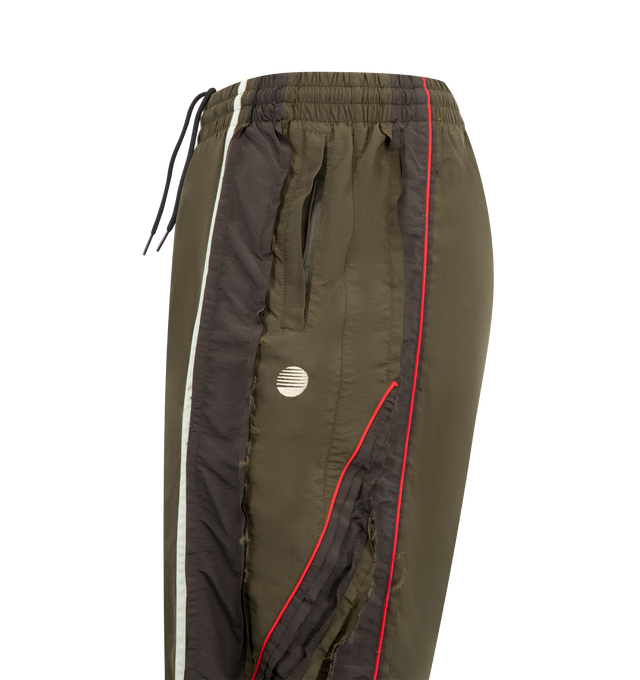 Image 3 of 3 - GREEN - MARTINE ROSE Layered Track Pant featuring interior drawstring tie closure, elasticized waistband, side zip pockets, back embroidered logo, zip hem and midweight ripstop fabric. 100% polyamide, Lining: 100% polyester. 