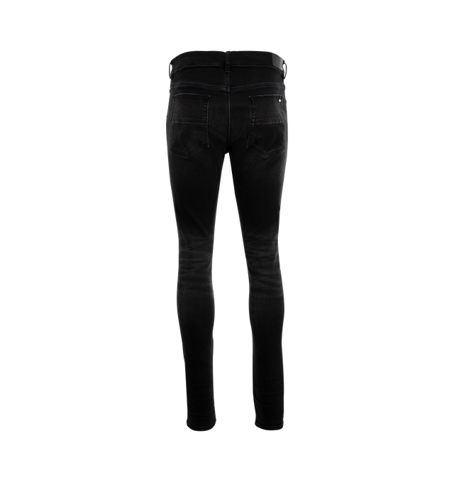 Image 2 of 3 - BLACK - Amiri MX1 Skinny Jeans are a 5-pocket style with a button and zip fly, distressing and rips overall, and a fitted silhouette with skinny legs. Polyester and elastane.  