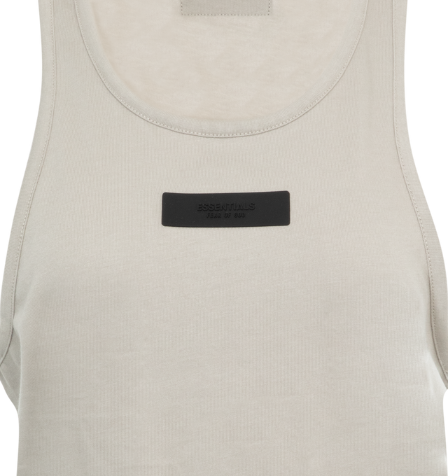 Image 2 of 2 - GREY - FEAR OF GOD ESSENTIALS Tank Top featuring a U-neckline, fixed straps, a relaxed body with dropped armholes, and minimalistic rubber brand labels at the upper back and chest. 53% cotton, 40% polyester, 7% rayon. 