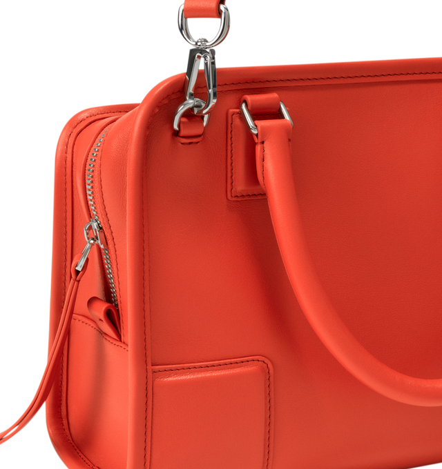 Image 16 of 17 - ORANGE - Loewe Small Amazona 180 Bag in leather features a relaxed silhouette anchored by a single toron top handle, designed to be carried open, while a concealed closure secures the main compartment, three carry options: short handle, removable shoulder strap and crossbody, zip closure with two leather zip pullers, two compartments, main compartment closed with magnetic closure, internal flat pocket, left side d-ring for customization, nappa lambskin lining, and embossed double L branding 