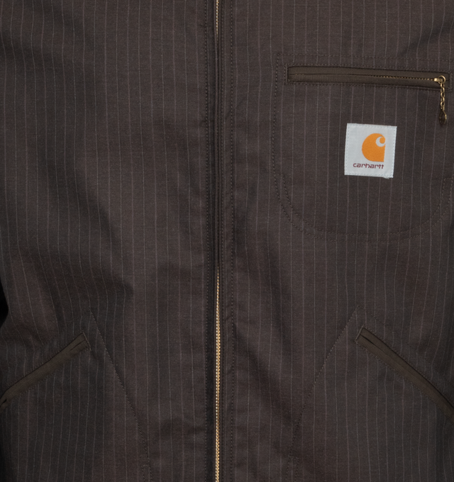 Image 3 of 3 - BLACK - JUNYA WATANABE X CARHARTT Stripe Oxford Jacket featuring collar, pinstripes, zip front closure, logo patch at chest, 3 front pockets, adjustable button tab at cuffs and locker loop at back collar. 100% polyester. Made in Japan. 