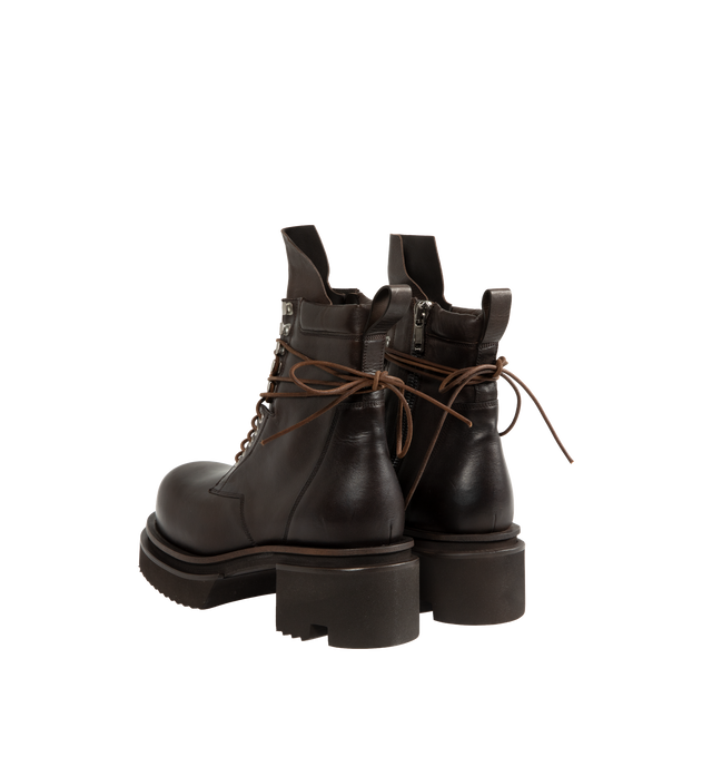 Image 3 of 4 - BROWN - Rick Owens Men's Laceup Bogun Boots are crafted from washed calf leather and feature a mid-calf silhouette with long wraparound laces, a rounded toe, and the brand's signature Bogun rubber mega creeper sole. Designed with eyelets and hooks, angled topstitched panels, an inner-leg zip closure, a back pull tab, and a toothed square heel for a bold, architectural look. Main Material: 100% Calf Leather. Lining: 100% Calf Leather. Insole: 100% Calf Leather. Intersole: 100% Cow Leather. Sol 