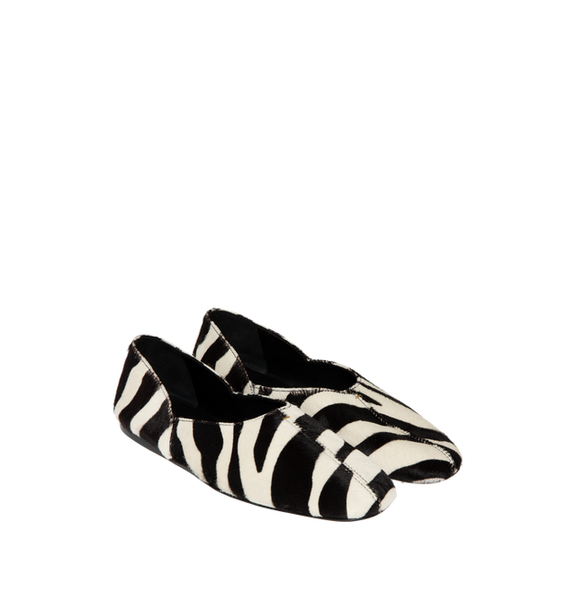 Image 2 of 4 - BLACK - KHAITE Jane Flat in Zebra Haircalf featuring a slipper-like flat, a flexible, cushioned insole for cloud-like comfort and signature gold staple detail at rounded vamp. Zebra print haircalf - 100% calfskin. Made in Italy. 