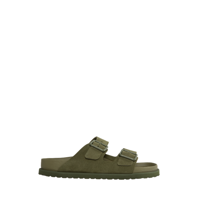 Image 1 of 4 - GREEN - Birkenstock's Arizona sandals in a regular width. The iconic Arizona sillhouette is  updated in suede featuring adjustable straps with buckle closures, logo details, shaped insole, and EVA outsole. Upper: Luxurious fine flesh out suede, a full grain leather that has been flipped to use the fuzzy side. Footbed: Anatomical shaped BIRKENSTOCK cork-latex footbed, covered with premium, color-matching smooth nappa leather. Sole: EVA outsole with a 3mm EVA welt updates the standard die-cut o 