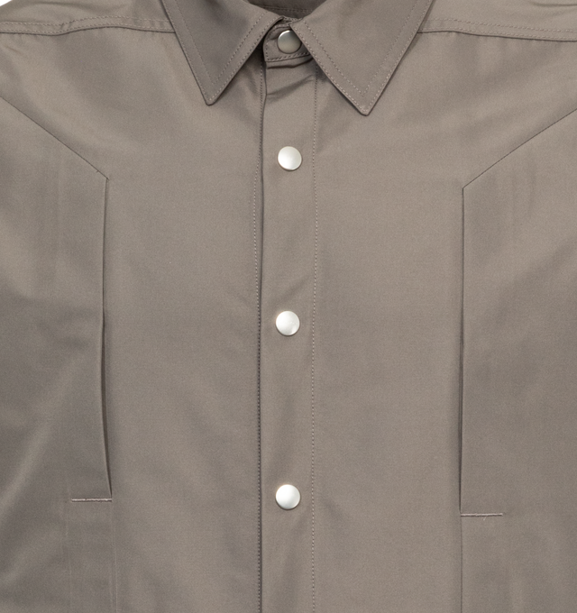 Image 3 of 3 - GREY - RICK OWENS Fogpocket Overshirt featuring front snap closure, hidden placket, point collar, long sleeves, chest vertical welt pockets and curved hem. 100% cotton. Made in Italy. 