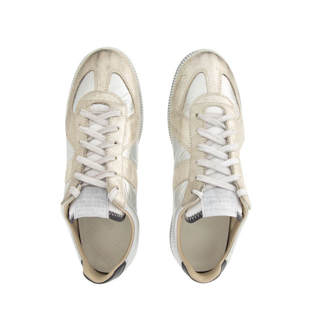 Image 5 of 5 - WHITE - MAISON MARGIELA Replica Sneakers featuring low-top, buffed nappa calfskin and calfskin suede, distressed throughout, lace-up closure, concealed elasticized gussets at vamp, logo patch at padded tongue, padded collar, white stitching at heel tab and treaded rubber sole. Upper: calfskin. Sole: rubber. Made in Italy. 