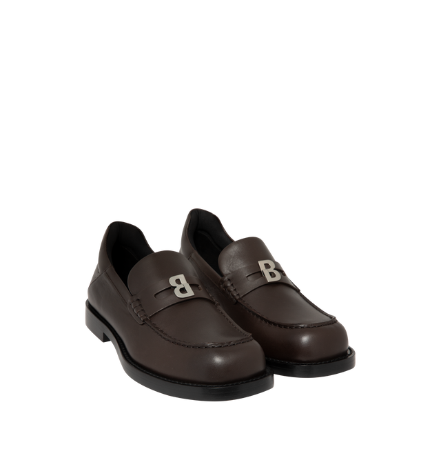 Image 2 of 4 - BROWN - Balenciaga Womens Comfy Loafers are crafted from smooth moka leather. Feature a slip-on silhouette, round toe, metallic detail across the vamp, thick sole, and leather construction designed to develop a natural patina over time. Main Material: Leather; Sole: Leather. Made in Italy. 