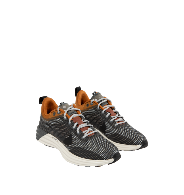 Image 2 of 5 - GREY - Nike Lunar Roam Sneaker featuring breathable mesh upper in desert bronze and metallic pewter colors, lace up style, TPU panels, foam midsole and rubber outsole. 