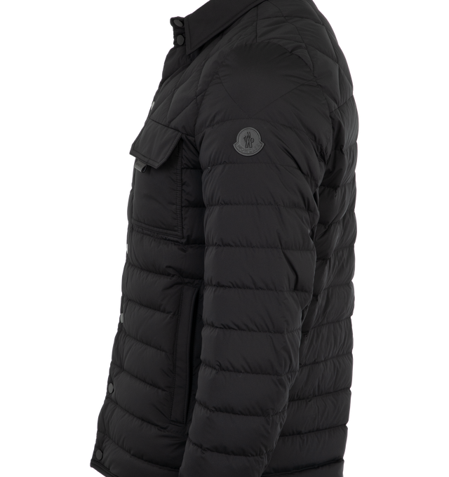 Image 3 of 3 - BLACK - Moncler Iseran Down Overshirt has a point collar, a snap front closure, a chest flap pocekt, side zip pockets, a signature leather logo patch on the sleeve, and snap cuffs for an adjustable fit. Down and feather fill. Made in Romania.  