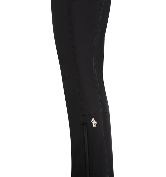 Image 3 of 4 - BLACK - MONCLER GRENOBLE Ski Pants featuring 3L 4-way stretch technical poplin, YKK AquaGuard highly water-resistant zipper and snap button closure, pockets with YKK AquaGuard highly water-resistant zipper closure, cuffs with YKK AquaGuard highly water-resistant zipper closure, powder cuffs, skicut hem protection and silicone logo. 68% polyester, 24% polyamide/nylon, 8% elastane/spandex. Made in Romania. 