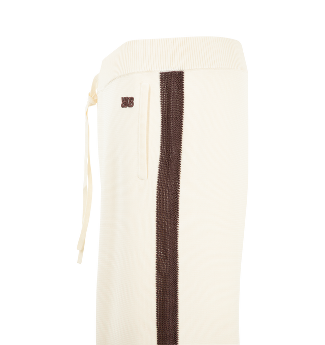 Image 3 of 3 - NEUTRAL - Wales Bonner Men's Tide Trackpant is crafted from a viscose-poly knit and features the brand's signature track pant silhouette in an ivory colorway. Detailed with crochet stripe accents along the sides of the legs, this elevated sportswear style combines a relaxed fit with refined texture and craftsmanship. 80% Viscose, 20% Polyester. 