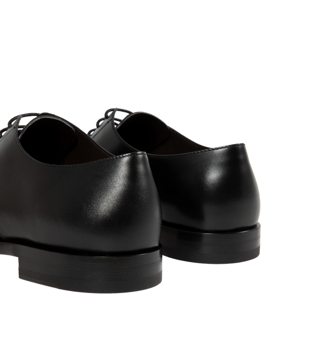 Image 3 of 4 - BLACK - THE ROW Novus Derby Shoe featuring classic lace-up oxford in polished calfskin leather with seamless molded construction, almond toe, and hand-stitched detailing. 100% calfskin leather. Made in Italy. 