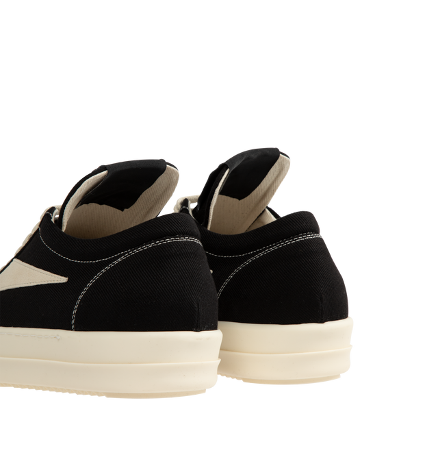 Image 3 of 5 - BLACK - Rick Owens DRKSHDW Vintage Denim Sneakers featuring low-top, lace-up closure, oversized tongue, treaded rubber sole and contrast stitching in white. Upper: cotton. Sole: rubber. Made in Italy. 