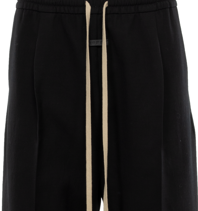 Image 4 of 4 - BLACK - FEAR OF GOD Single Pleat Wide Leg Trousers featuring elastic waist with drawstring, wide leg, low-crotch style, mid-weight and non-stretchy fabric. 56% cotton, 43% virgin wool, 1% nylon. Lining: 100% cotton. 