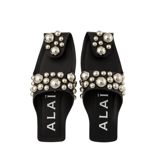 Image 4 of 4 - BLACK - ALAIA Studded Leather Slides featuring semi open flat mules playing on the folding of a leather piece and embellished with metal spheres. 100% calf leather. Made in Italy. 