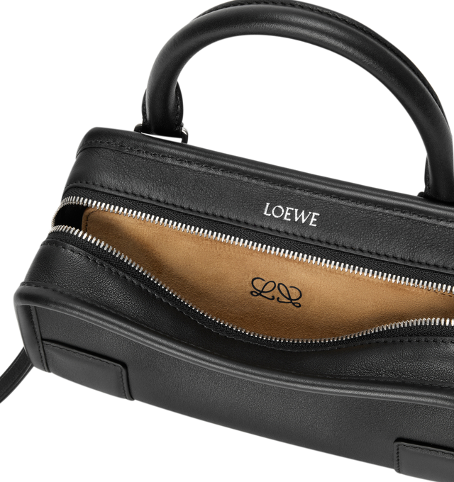 Image 7 of 11 - BLACK - Loewe Mini Amazona 180 Bag in leather features a relaxed silhouette anchored by a single toron top handle, designed to be carried open, while a concealed closure secures the main compartment, removable shoulder and crossbody straps, two carry options: short handle, removable and adjustable crossbody strap, zip closure with two leather zip pullers, two compartments, main compartment closed with magnetic closure, left side d-ring for customization, suede and nappa lambskin lining, and  