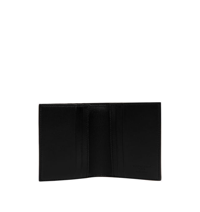 Image 3 of 3 - BLACK - SAINT LAURENT PARIS reversible card case in smooth leather with embossed SAINT LAURENT PARIS signature, six inner card slots, silver-toned hardware and six outer card slots. Dimensions: 3.9" x 3.1" x 0.4". CALFSKIN LEATHER. Made in Italy. 