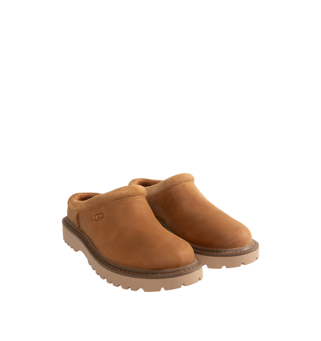 Image 2 of 4 - BROWN - UGG Men's Birch Clog II is crafted from premium suede and features a slip-on clog silhouette with a soft lining and cushioned footbed for exceptional everyday comfort. These designer clogs combine UGG's signature cozy feel with durable construction, making them a versatile choice for both indoor and outdoor wear. Main Material: Suede. Lining: Soft Textile. Sole: Rubber. 