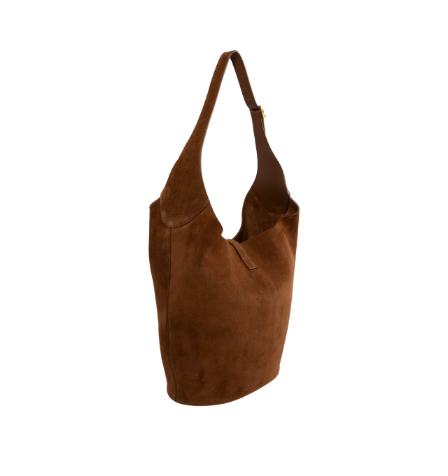 Image 2 of 3 - BROWN - Saint Laurent hobo bucket version of the iconic LE 5  7 in suede with leather lining, defined by its leather tab closure decorated with the CASSANDRE. Spacious and lined in tonal leather, it features one main compartment with an inner zip pocket. An adjustable strap allows for bespoke carry options. Featuring bronze-toned hardware, four metal feet. Measures 10.217.3" x 12.6" x 1.2" with 13" handle drop. Made in Italy. 