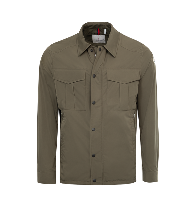Image 1 of 2 - GREEN - MONCLER Ferma Shirt Jacket featuring micro soft polyester, rainwear lining, zipper and snap button closure, zipped inner and outer pockets, adjustable cuffs, hem with elastic drawstring fastening and inner label with fabric description. 100% polyester. 