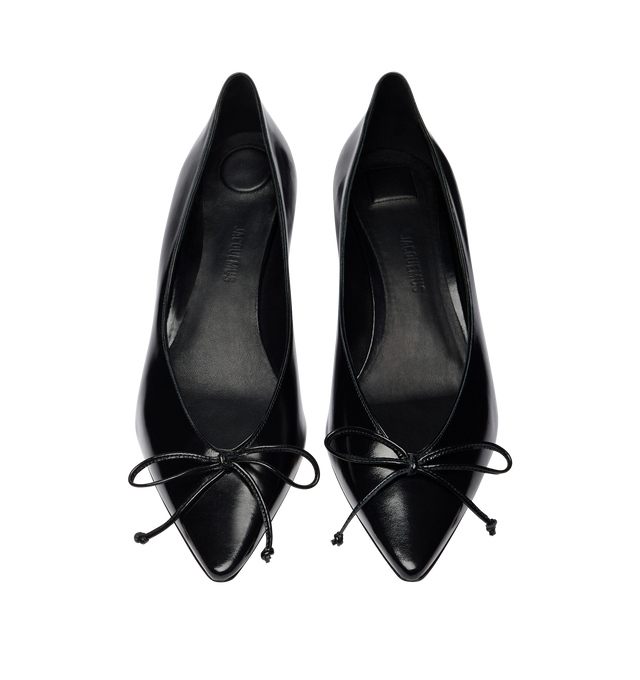 Image 4 of 4 - BLACK - JACQUEMUS Tourni Heel featuring pump heels in smooth leather, pointed toe, small fixed bow, stitched edges, lambskin leather insole and lining, 4.5cm asymmetric twisted heels with lacquered finish and contrast outsole. 100% cow leather. Outsole: 100% cow leather. Made in Italy.  