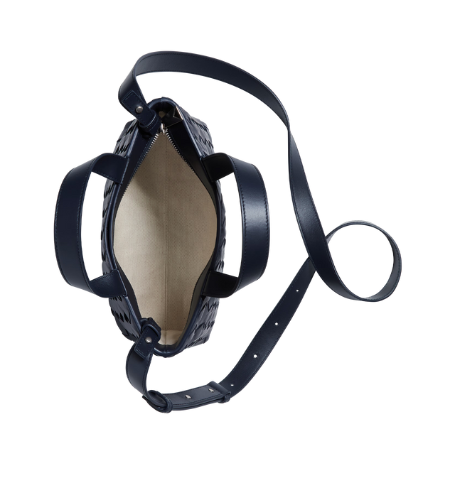 Image 3 of 3 - NAVY - BOTTEGA VENETA Mini Intrecciato Zipped Tote featuring mini Intrecciato leather zipped tote bag with adjustable and detachable cross-body strap, one external hidden pocket with magnetic closure, one interior zipped pocket and two flat open pockets and zipper closure. Calfskin. Lining: canvas. 7.1" x 10.6" x 3.9". Made in Italy. 