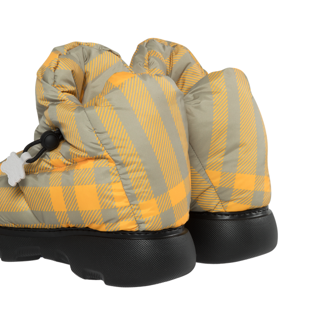 Image 3 of 4 - YELLOW - BURBERRY Check Pillow Boots featuring a rounded toe, drwcord closure and checked insole with Burberry lettering at sole and Equestrian Knight tags.100% polyester upper. 30% polyamide / 30% polyester / 20% brass / 20% thermoplastic polyurethane trim.  56% polyamide / 30% cotton /14% elastane lining. 85% EVA / 15% thermoplastic polyurethane sole. Made in Italy. 