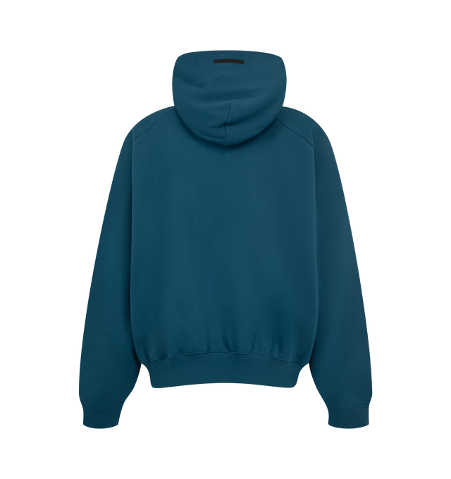 Image 2 of 2 - BLUE - Fear of God ESSENTIALS Men's Classic Half Raglan Hoodie is crafted from heavyweight cotton-blend fleece and features a classic relaxed-fit silhouette with back raglan sleeves for enhanced comfort and mobility. Designed with dual FOG puff-print graphics at the shoulders and a racing-inspired ESSENTIALS puff-print graphic across the front, this elevated everyday essential is finished with a double-layer hood, side pockets, rib-knit cuffs and hem, and a signature label at the hood. Main M 