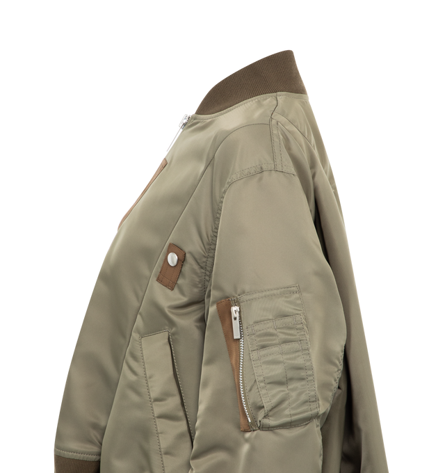 Image 3 of 3 - NEUTRAL - Sacai Women's Nylon Twill Blouson featuring Nylon shell, ribbed collar, hem and cuffs and two-way zip fastening in front. 100% nylon with 55% Polyester / 44% Cotton / 1% Polyurethane grosgrain combo and 100% Cupro lining and 100% Polyester fill. Made in Japan. 