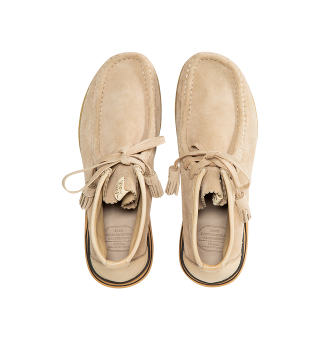 Image 5 of 5 - NEUTRAL - VISVIM Beuys Trekker Folk high moccasins featuring hand-sewn upper crafted from UK vegetable tanned cowhide, crepe non-replaceable outsole, cork insole for enhanced cushioning and moisture absorption, TPU heel stabilizer, and lightweight EVA Phylon midsole. The sizing and fit can vary depending on the style of shoe and its design along with the material used for its construction. Please be aware that the natural leather hides have been specially treated to create a unique texture wh 