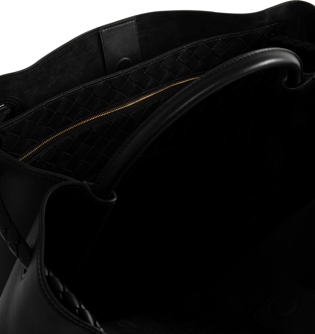 Image 4 of 4 - BLACK - BOTTEGA VENETA Large Andiamo Bag featuring top handle bag in silky calf leather with signature knot detail and sliding cross-body strap, intrecciato leather internal pocket and magnetic closure. Calfskin. Lining: suede. 13.8 x 16.5 x 7.1. Handle drop: 3.5. Strap drop: 17.7. Made in Italy. 