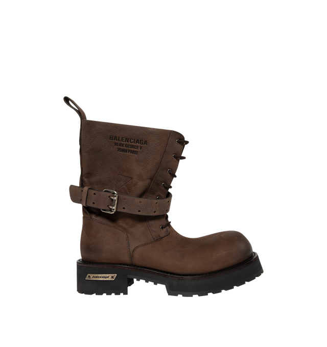 Image 1 of 4 - BROWN - Balenciaga Mens Venom Lace-Up Booties are crafted from grained calfskin leather. Feature a lace-up design, extra round toe, adjustable buckle strap, worn-in finish, debossed logo at the upper, engraved logo plate at the outsole, back pull loop, and thick toothed rubber sole. Main Material: Upper: Calfskin Leather; Sole: TPU; Insole: Calfskin Leather. Made in Italy. 