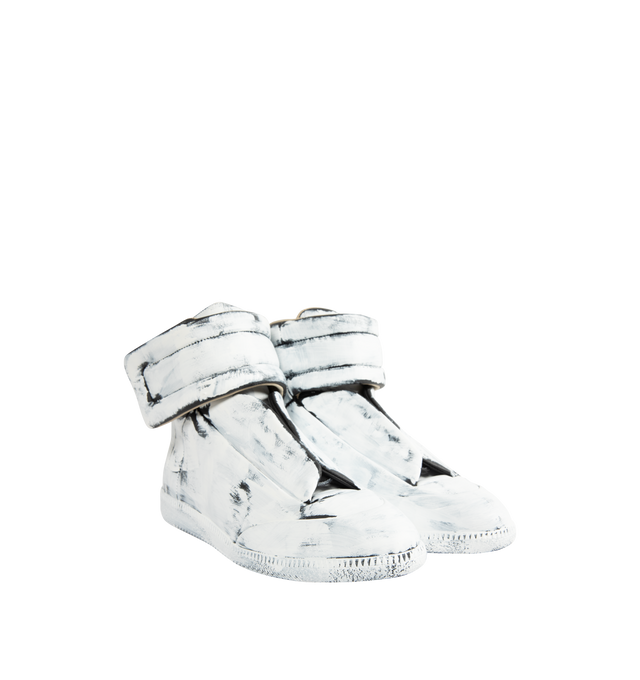 Image 2 of 5 - WHITE - MAISON MARGIELA Future Sneaker Bianchetto featuring calfskin, upper and sole are finished with our Bianchetto technique, white paint brushed across the surface to reveal the black leather beneath at the edges, hidden strap folds across the tongue and signature white stitch at the back. 