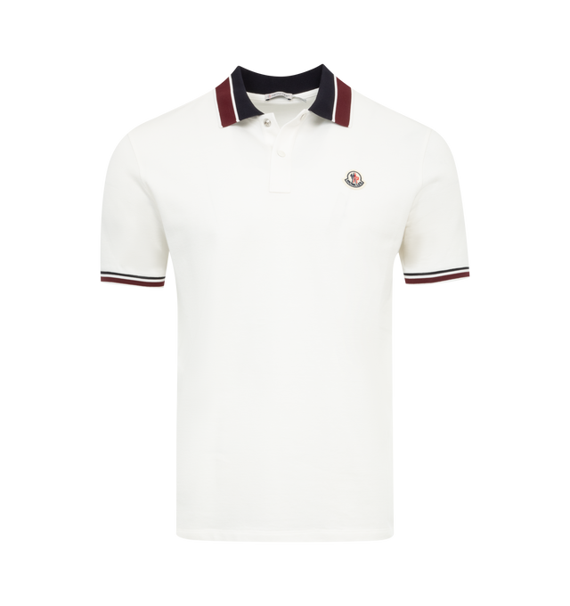 Image 1 of 2 - WHITE - MONCLER Logo Polo featuring cotton piquet, collar, button placket closure, short sleeves and felt logo patch. 100% cotton. 